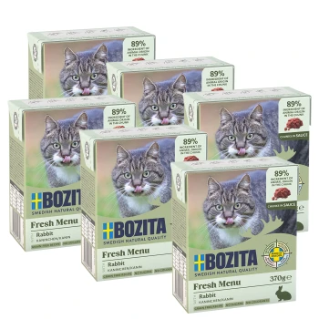 Sechs Boxen Bozita Fresh Menu Katzenfutter in Kaninchen-Geschmack, mit einer Katze, die sich auf der Verpackung die Lippen leckt, mit 89% Zutaten tierischen Ursprungs.
