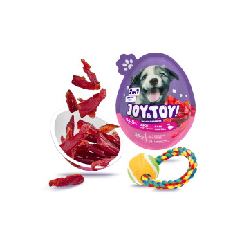 Lila eiförmige „JOY & TOY! 2in1“ Hundesnack-Verpackung mit Welpenbild, Schale mit Enten-Jerky-Streifen und buntem Tau-Ball-Spielzeug.
