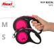 A hand holding two Flexi neon tape leashes in black and pink, labeled 'M' and 'S' for medium and small sizes.