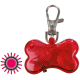 Rotes, knochenförmiges Haustierlicht mit einem Metallclip, entworfen für Sichtbarkeit während der Spaziergänge, mit einem leuchtenden Effekt.