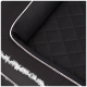 Nahaufnahme eines luxuriösen schwarzen Haustierbettes mit einem gesteppten Design und braunen Kanten.
