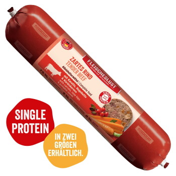 Fleischeslust Futterbox – Holzkiste mit Hundefoto, dem Text „Natürlich & Artgerecht“ und einer roten Rolle mit der Beschriftung „Zartes Rind (Tender Beef)“.