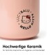 Eine rosa Keramik-Hundenapf mit einem Hello Kitty-Design und dem Text "Hochwertige Keramik für höchste Ansprüche an Hygiene und Sauberkeit."