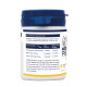 White pet supplement jar with blue lid labeled "Feed material for dogs and cats" showing dosing table with 1–3 scoops.
