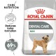 Royal Canin Dental Care Mini dog food bag with small dog illustration and text on reducing tartar formation by up to 69%.