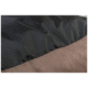Nahaufnahme eines Haustierbettes mit einer strukturierten schwarzen Oberseite mit kleinen Punkten und einem weichen braunen Boden, das sein gemütliches Design zeigt.