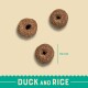 Three round, brown pet food kibbles with a hole in the center, labeled "Duck and Rice," measuring 19 mm in diameter.