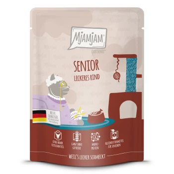 Tiernahrungstasche mit der Aufschrift "Mjamjam Senior Leckeres Rind" mit einer Cartoon-Katze, die hohen Fleischanteil, getreidefrei, Mono-Protein und Seniorenfutter hervorhebt.