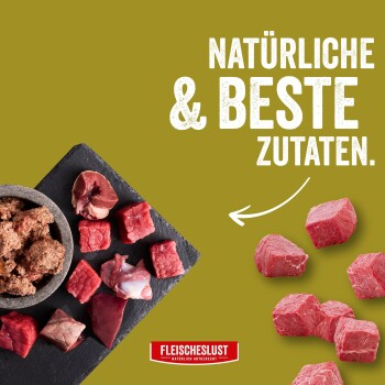 Rohe rote Fleischstücke und Hackfleisch auf Schiefer; Pfeil und Text 'NATÜRLICHE & BESTE ZUTATEN.' mit FLEISCHESLUST-Logo.