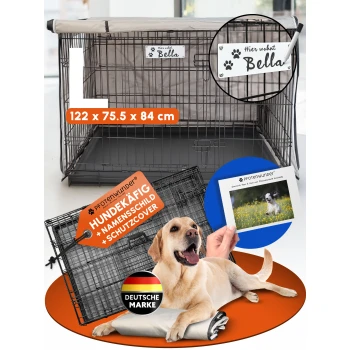 Schwarzer Metall-Hundekäfig auf Gras mit einem Maßband, das etwa 110 cm Länge zeigt, und Verpackung mit Anleitung.