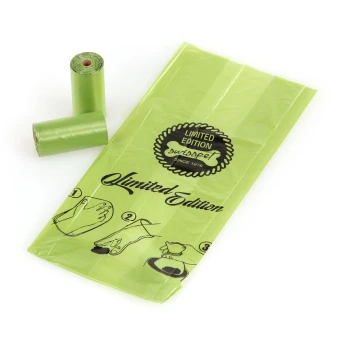 Sacs à déchets pour animaux de compagnie verts en rouleau, avec une étiquette 'Édition limitée' et des instructions d'utilisation illustrées sur l'emballage.