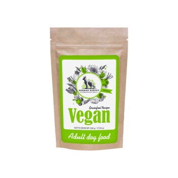 Veganes Hundefutter für Erwachsene in einer 500g braunen Papiertüte mit einem grünen Etikett, das florale Designs und ein Deutsches Shephy-Logo zeigt.
