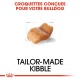 Image d'un morceau de croquette conçu pour les bulldogs, avec le texte "CROQUETTES CONÇUES POUR VOTRE BULLDOG" et "TAILOR-MADE KIBBLE."