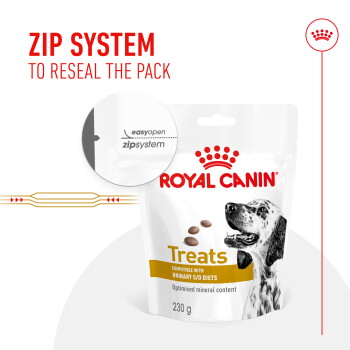 Royal Canin dog treats package featuring a Dalmatian, highlighting a zip system for resealing, 230g, compatible with urinary S/O diets.