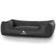 Schwarzes gestepptes Hundebett mit erhöhten Seiten, mit dem Logo "KNUFFELWUFFF" auf der Vorderseite.