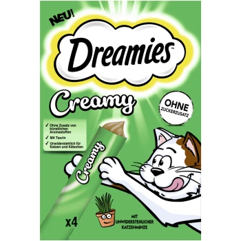 Dreamies Cremige Katzenleckerliverpackung mit einer verspielten Katze, die nach einer Tube greift, mit Text, der "Ohne Zuckerzusatz" und "Mit Taurin" hervorhebt.