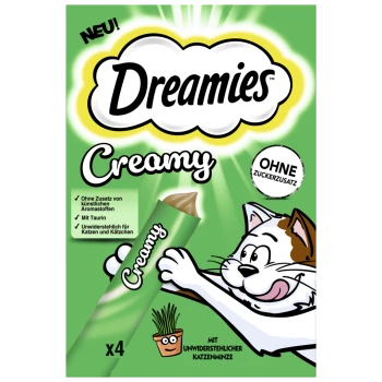 Dreamies Cremige Katzenleckerliverpackung mit einer verspielten Katze, die nach einer Tube greift, mit Text, der "Ohne Zuckerzusatz" und "Mit Taurin" hervorhebt.