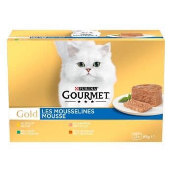 Boîte de nourriture pour chat Purina Gourmet Gold avec un chat blanc à poils longs, assiette de mousse pâté, étiquette 'Les Mousselines Mousse' et '12x 85g'.