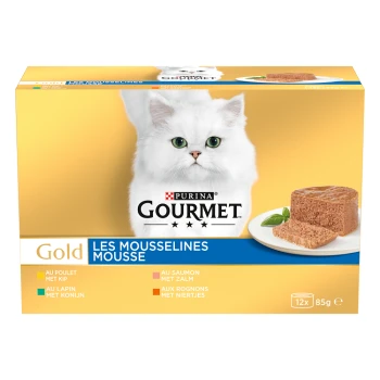 Boîte de nourriture pour chat Purina Gourmet Gold avec un chat blanc à poils longs, assiette de mousse pâté, étiquette 'Les Mousselines Mousse' et '12x 85g'.
