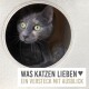 Ein gemütliches Katzenversteck mit einer runden Öffnung, aus dem eine graue Katze herausblickt. Der Text lautet: "Was Katzen Lieben ♥ Ein Versteck mit Ausblick."