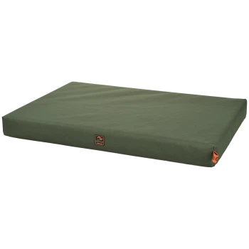 Olive-green rectangular dog bed cushion with orange label "Dogs Creek" and orange corner tag.