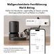 Grauer automatischer Futterspender für Haustiere mit einer Katze, die frisst, und einem Smartphone, das die Fütterungszeitpläne auf Deutsch anzeigt.