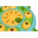 Interactive dog puzzle toy with yellow and green sections, featuring hidden treats in compartments and a paw print design.