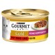 Eine Dose Purina Gourmet Gold Katzenfutter mit einem weißen Kätzchen auf dem Etikett, mit dem Text 'Mit Rind und Huhn' und 'Feine Komposition.'