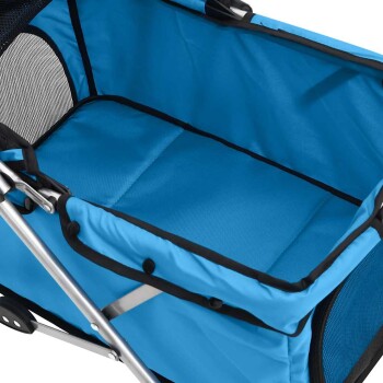 Innenraum eines blauen Haustierwagens mit gepolsterter Basis und Netzseite zur Belüftung, entworfen für Komfort und Sicherheit.