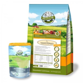 Eine Tüte Bellfor "Wiesen-Schmaus" Tiernahrung mit einem malerischen Landschaftsdesign, neben einem Behälter mit "Vermal Pulver."