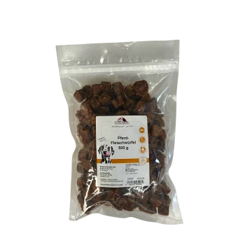 Packung Tackenberg Pferd-Fleischwürfel 500g Pferdefleischwürfel Hundesnacks in einem klaren wiederverschließbaren Beutel.
