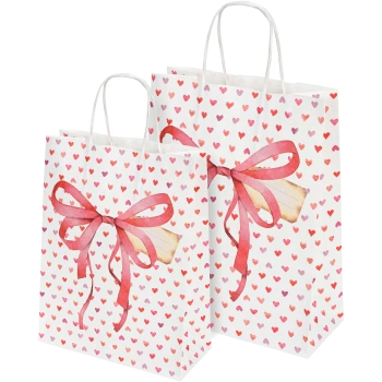 Zwei dekorative Geschenktüten mit roten Bändern und Herzmustern in verschiedenen Rosa- und Rottönen, ideal für haustierbezogene Geschenke.