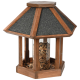 Holz-Vogelfutterspender mit sechseckiger Form, mit einem schwarzen Schindeldach und einem transparenten Zentrum, das mit Vogelfutter gefüllt ist.