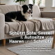 Border Collie auf einer beigen Sofadecke; Einblendtext: „Schützt Sofa, Sessel & Autositze vor Haaren und Schmutz“.