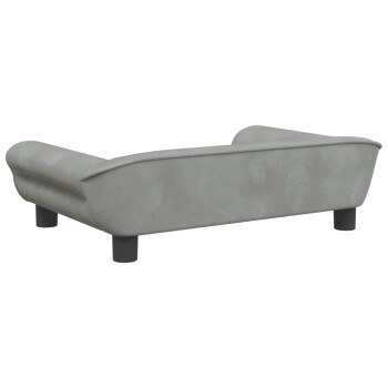 Graues Haustiersofa mit geschwungenen Armen und schwarzen Beinen, von hinten betrachtet, das sein modernes Design zeigt.