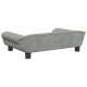 Graues Haustiersofa mit geschwungenen Armen und schwarzen Beinen, von hinten betrachtet, das sein modernes Design zeigt.