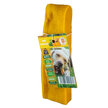 Gelbes Hundekauspielzeug mit einem Etikett, das einen Hund zeigt, der auf einem Leckerli kaut, gekennzeichnet mit "XL Größe" und "mit Kurkuma", was auf die Zugabe von Kurkuma hinweist.