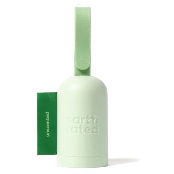 Green pet waste bag dispenser with a textured handle, featuring a pack of unscented bags labeled "earth rated."