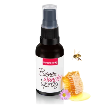 Flasche HerzensTier Bienenwunder Spray mit Wabe, Honig, einer Biene und einer pinken Blume auf weißem Hintergrund.
