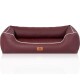 Burgunderfarbenes Haustierbett mit weißer Paspelierung und strukturiertem Innenraum, mit einem braunen Etikett mit dem Logo "KNUFFERWUFFS."