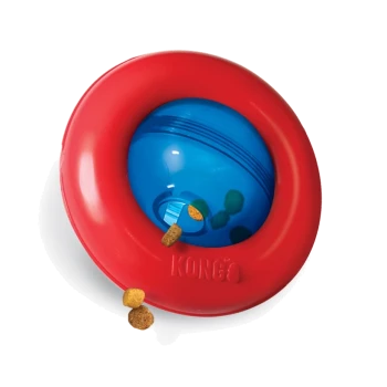 Red and blue KONG pet toy with treats spilling out, designed for interactive play and mental stimulation for dogs.