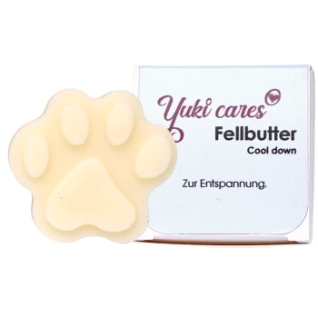 Yuki cares Fellbutter, ein pfotenförmiger Haustierbalsam in einer hellen Farbe, mit Verpackung, die "Cool down" und "Zur Entspannung" liest.
