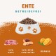 Hundefutter in einer weißen Schüssel mit Pfotenabdrücken, mit 50% Ente, 26% Süßkartoffel und Orange, beschriftet "Getreidefrei."