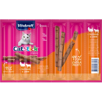 Vitakraft CatStick klassische Verpackung mit einer weißen Katze, mit 6 fleischigen Sticks. Der Text hebt '95% Extra Fleisch' und 'Truthahn & Lamm' hervor.