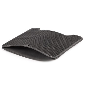 Schwarze Haustierpflege-Matte mit einer strukturierten Oberfläche und abgerundeten Kanten, entworfen für Komfort und Stabilität während der Pflege.