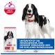 Schwarz-weißer Hund neben Hill's Science Plan Erwachsenenfutterbeutel; Aufschrift 'ACTIVBIOME+ MULTI BENEFIT' und blaues Banner auf Deutsch.