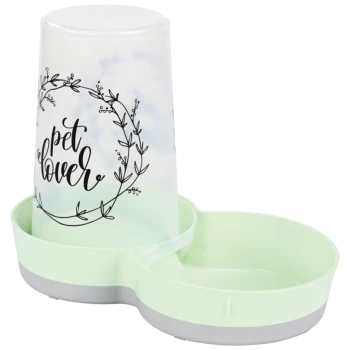 A pet food and water bowl set featuring a light green base and a clear cup with the text "pet lover" surrounded by a floral wreath design.