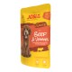 JosiDog Mini Adult Hundefutterbeutel mit Rindfleisch & Gemüse in Sauce, 84% Fleisch, präbiotisches Inulin, Vitamine E & D3, mit braunem Hundebild.
