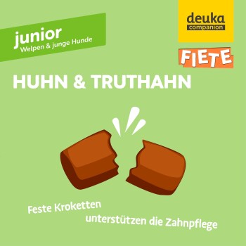 Verpackung für Junior-Hundefutter mit "Huhn & Truthahn" (Hühnchen & Pute) mit zerbrochenen Krokettenstücken und Text zur Förderung der Zahnpflege.