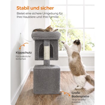 Ein grauer Katzenbaum mit einer gemütlichen Liegefläche und einem Kratzbaum, auf dem eine Katze entspannt und eine andere hochgreift. Der Text hebt die Stabilität hervor.
